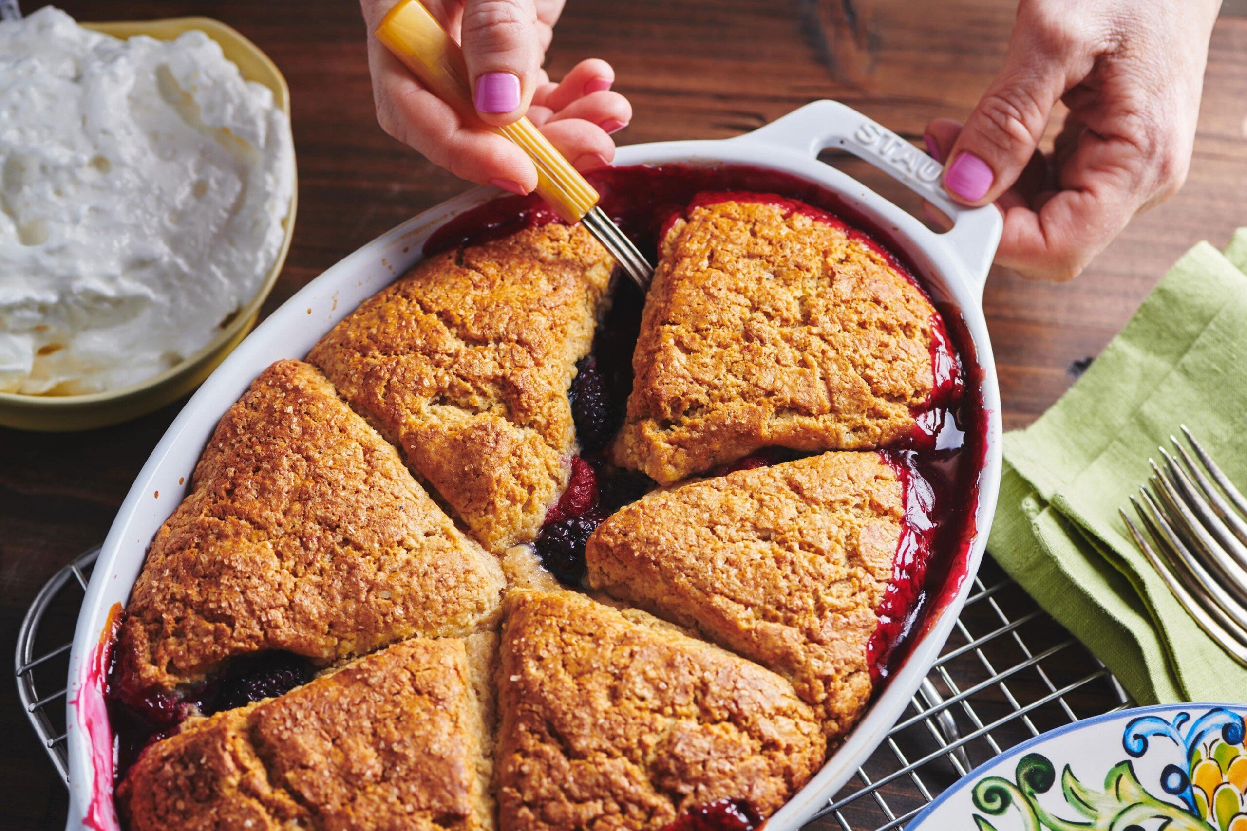 Serving Old Fashioned Berry Cobbler from dish.