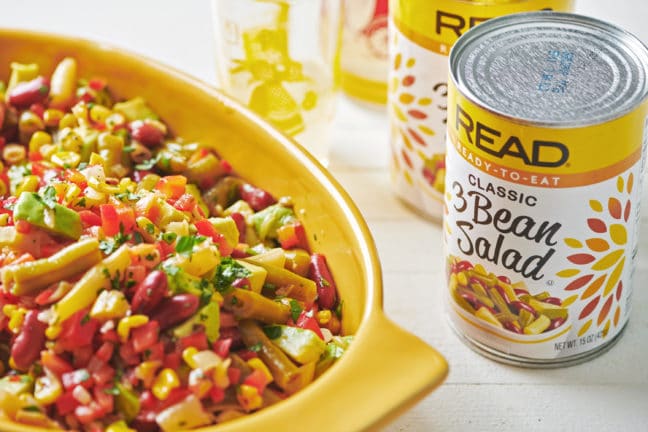 Mexican Avocado, Corn and Three Bean Salad next to cans of Read three bean salad.