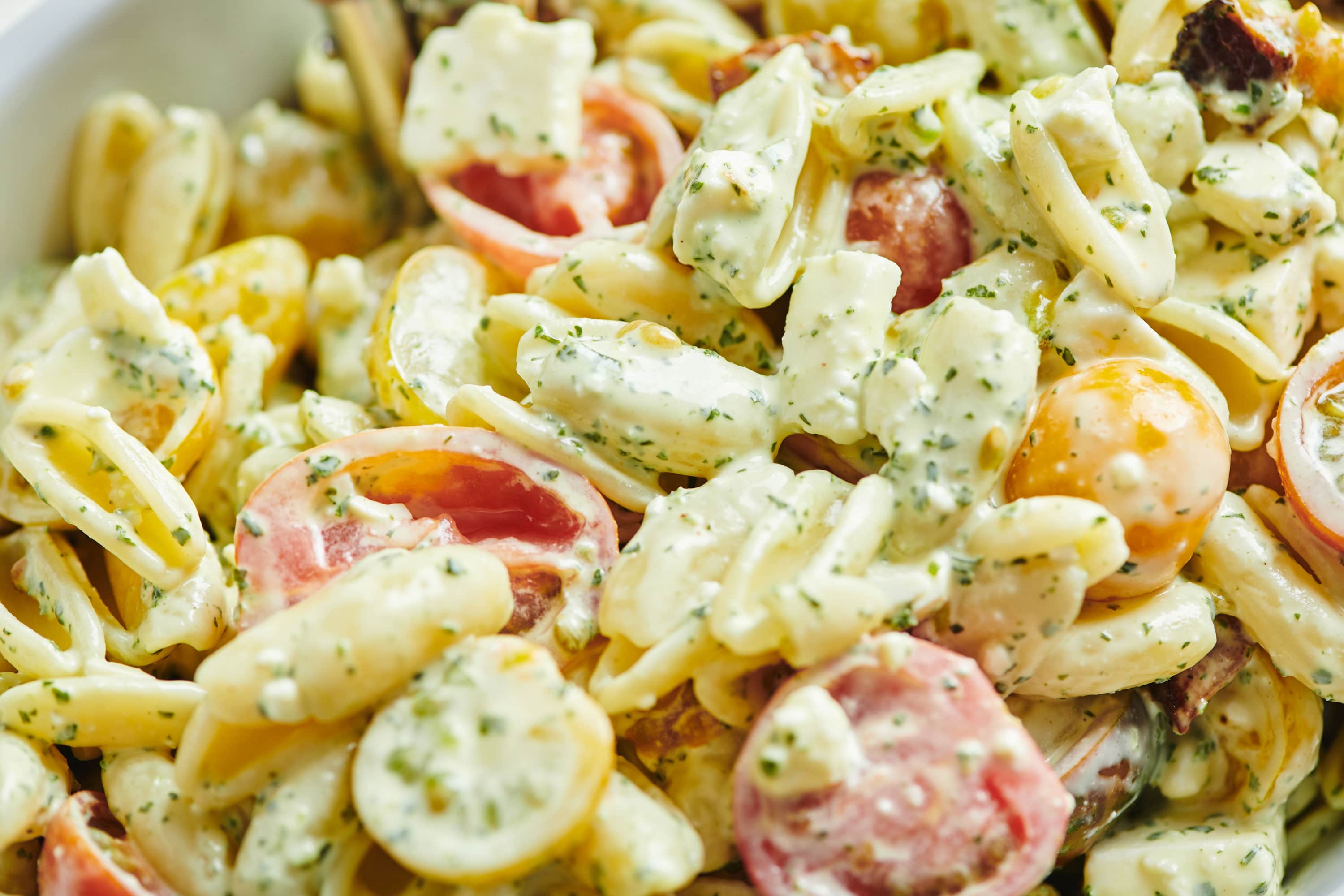 Pasta Salad tossed with Tomatoes, Feta and Herbed Mayonnaise.