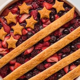 Patriotic Berry Cobbler decorated with a crust of stars and stripes.