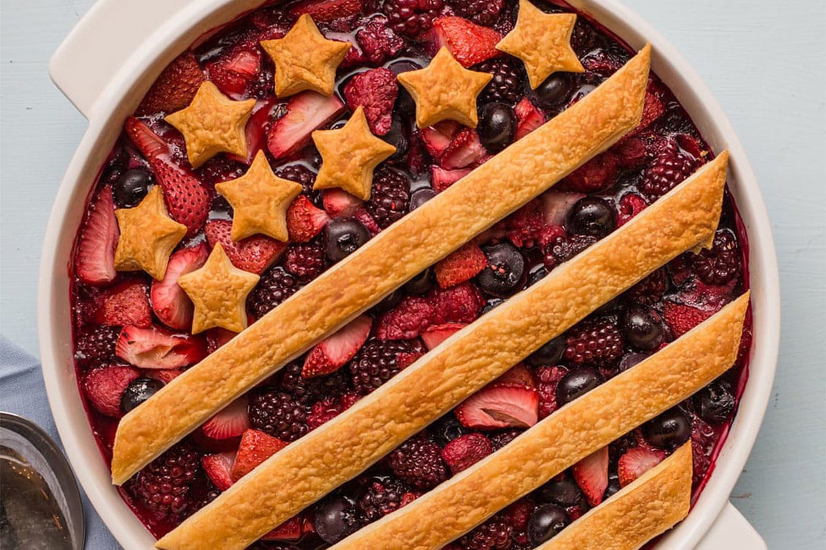 Patriotic Berry Cobbler decorated with a crust of stars and stripes.
