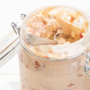 Pimento cheese spread in glass jar.