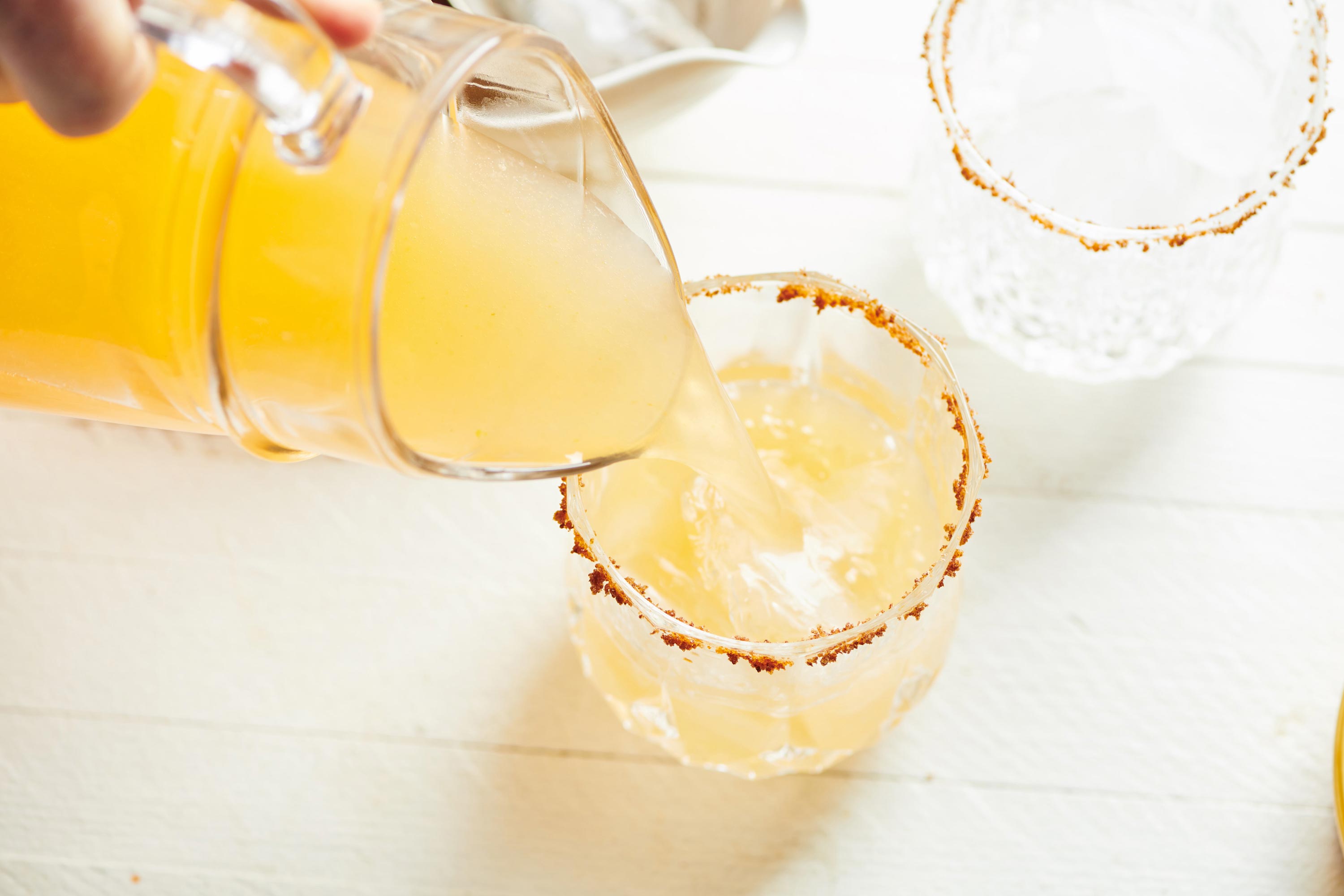 Pitcher pouring a Pomelo Paloma.