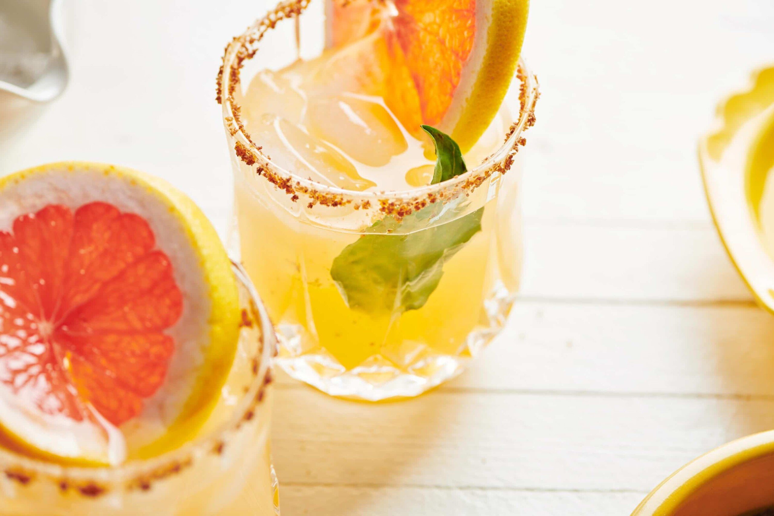 Pomelo Paloma in glasses on table.