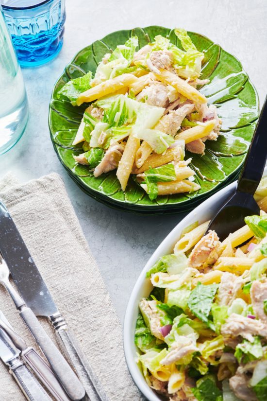 Chicken Caesar Pasta Salad in a bowl and on a plate.