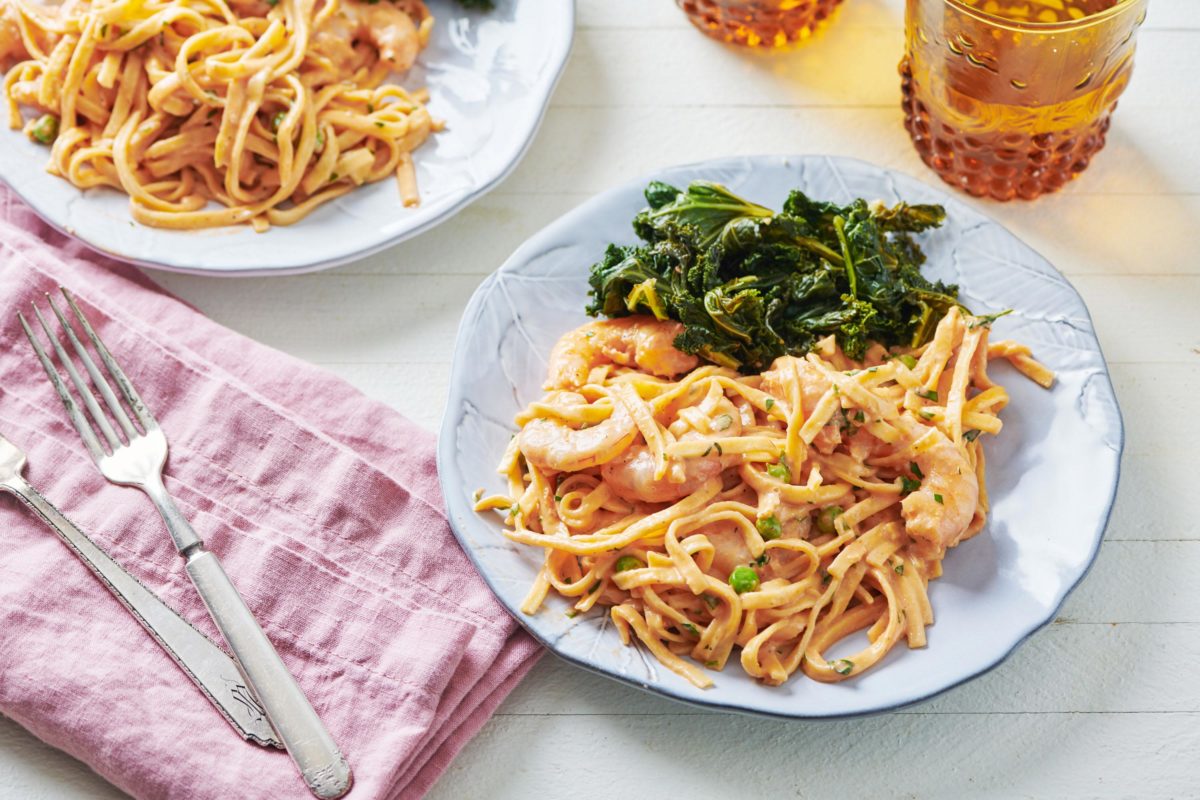 Plate of shrimp pasta and Kale.