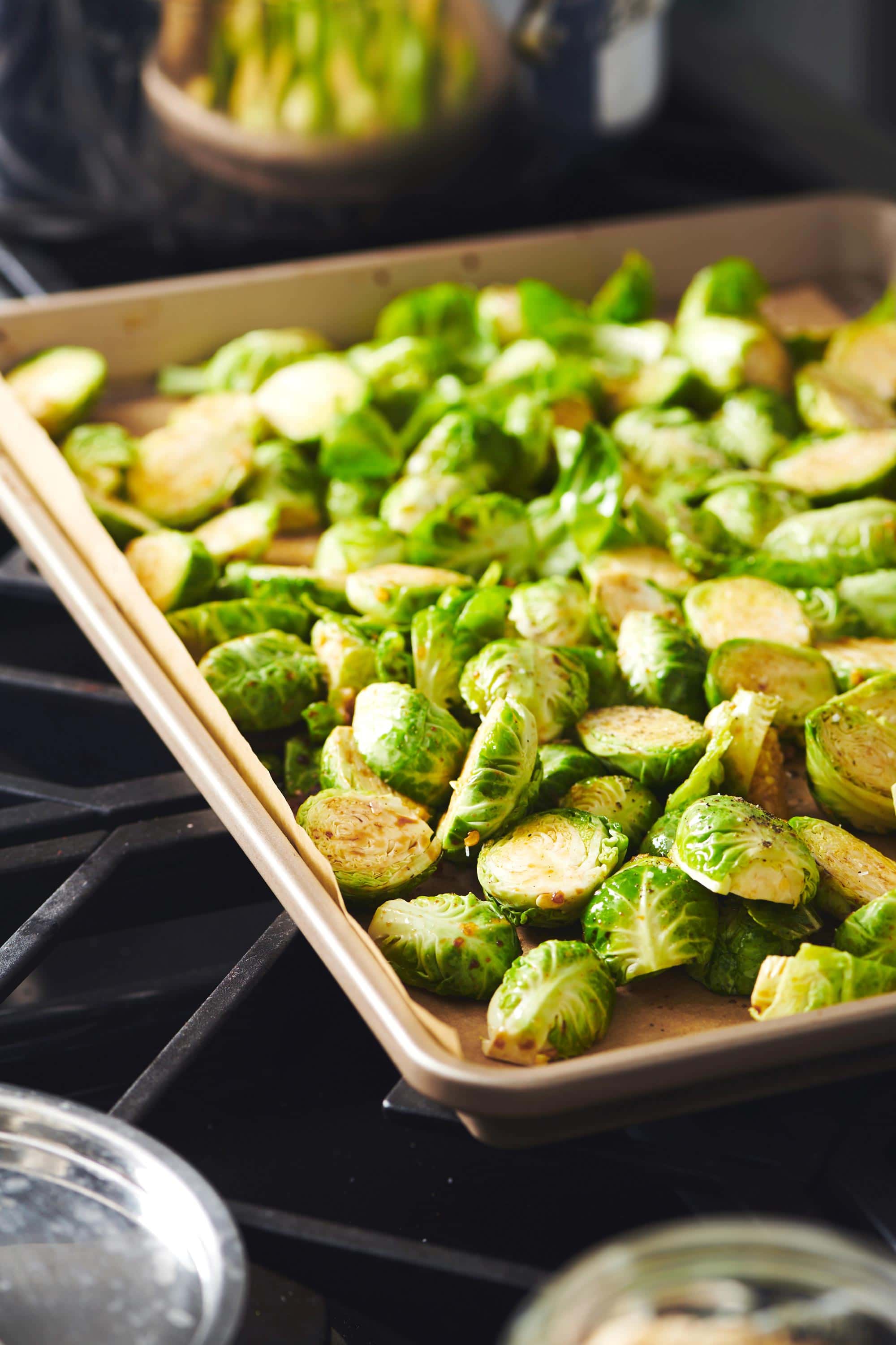 Brussels Sprouts on a lined baking sheet.