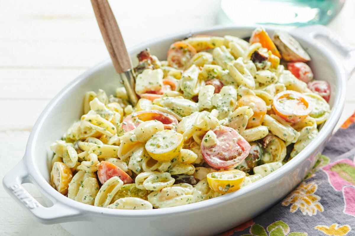Serving dish with Pasta Salad with Tomatoes, Feta, and Herbed Mayonnaise.