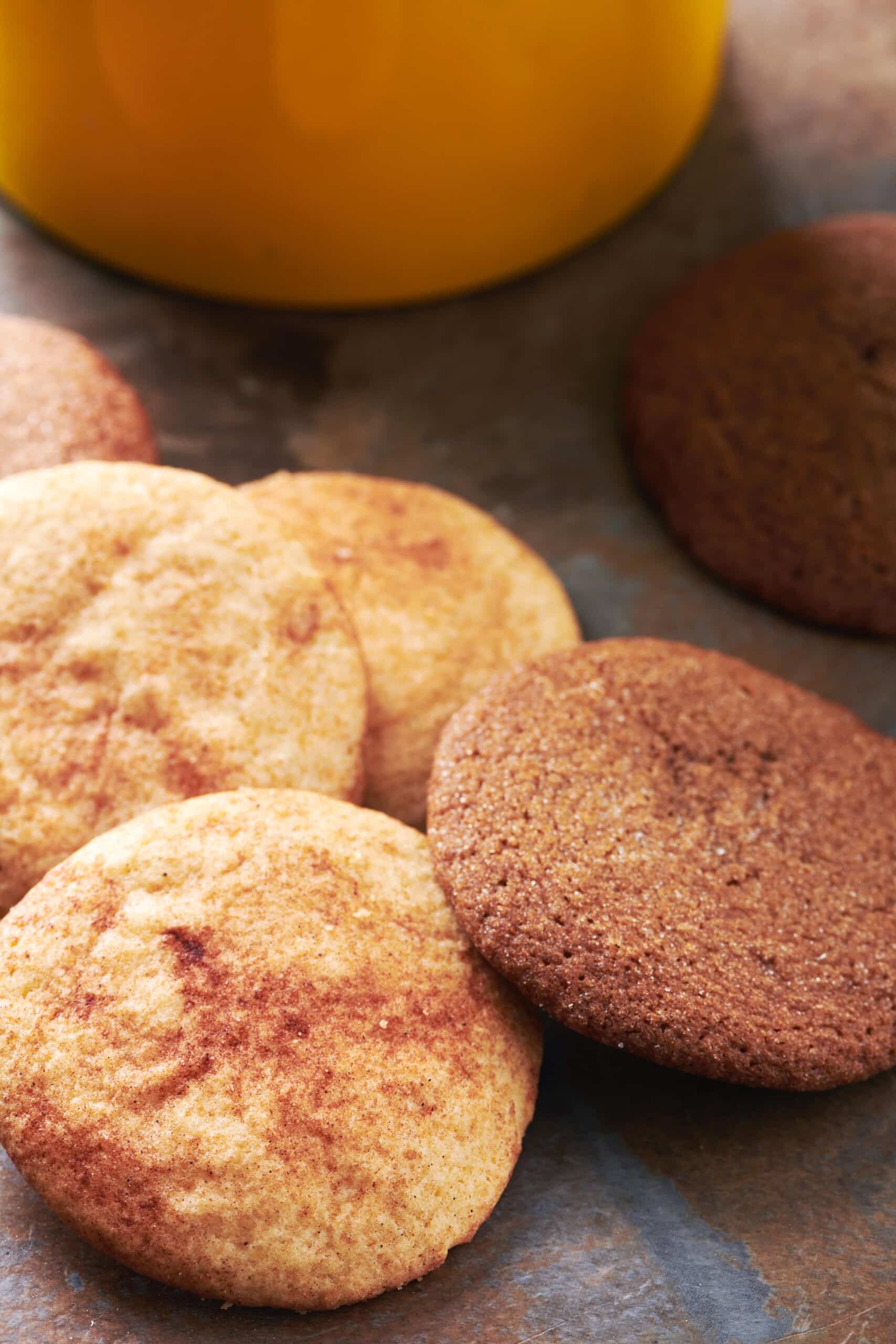 Snickerdoodles on a dark countertop.