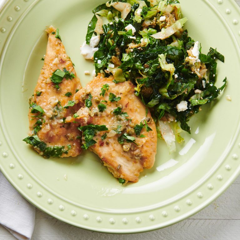 Chicken Piccata on a plate with greens.