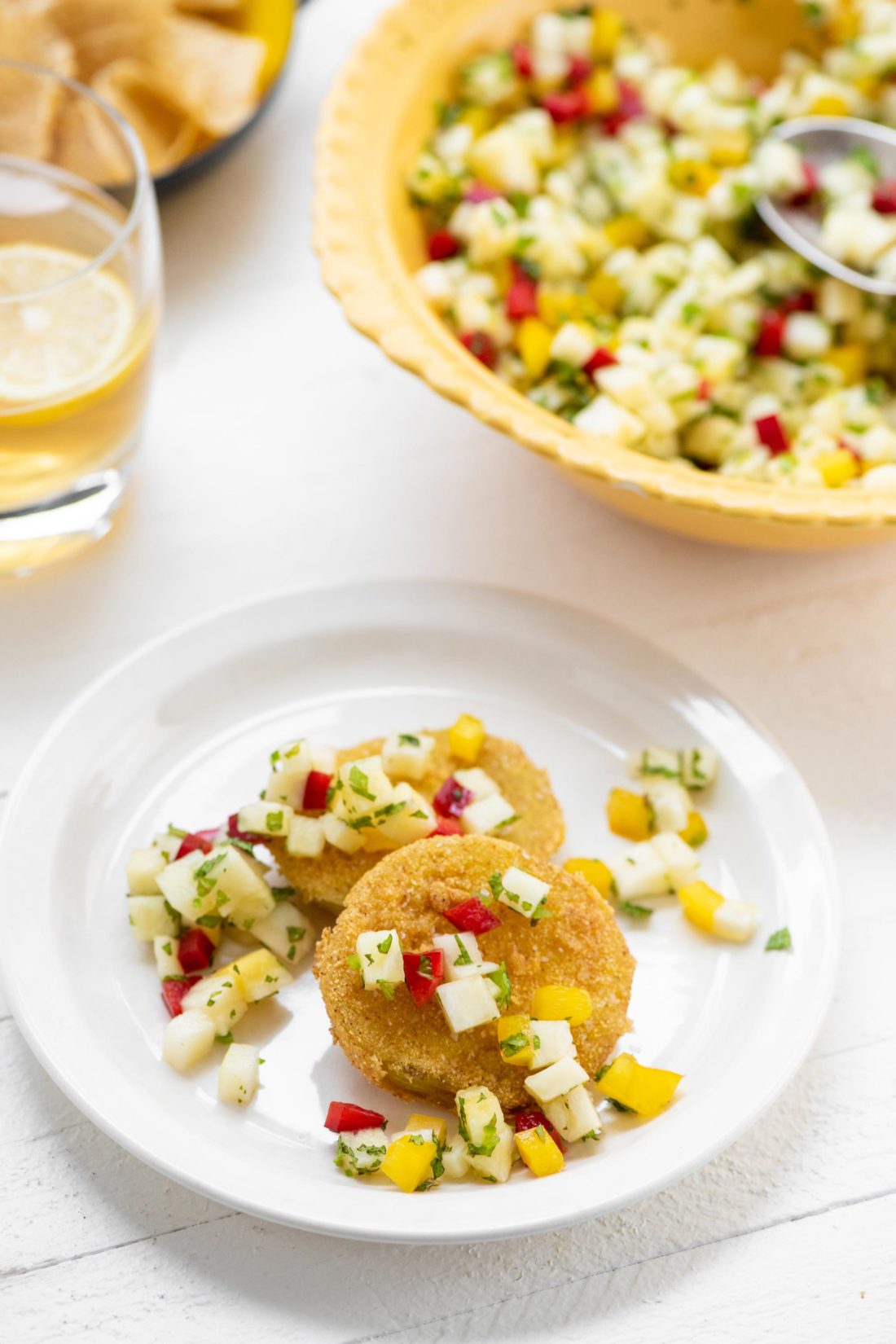 Fried Green Tomatoes with Pineapple Mint Salsa on a small plate.