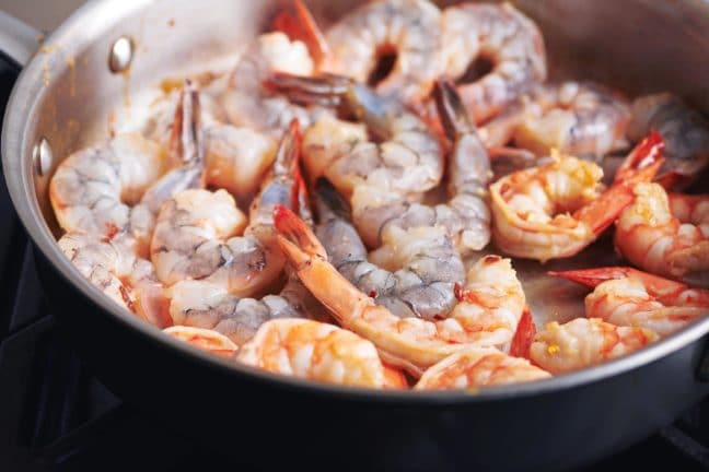 Partially-cooked Shrimp in a pan.