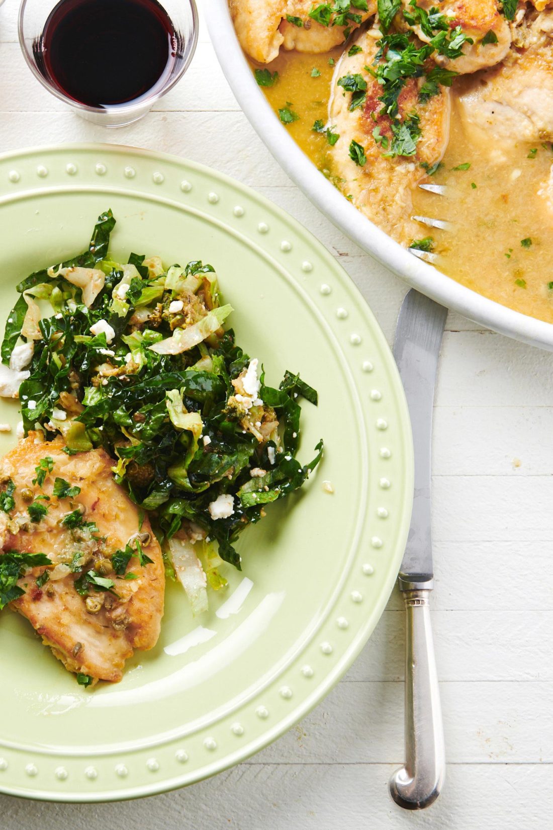 Romaine, Kale and Broccoli Salad on a plate with chicken.