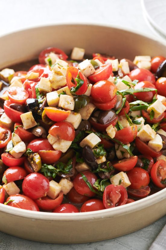 Tomato, Mozzarella and Basil Salad heaped in a large bowl.