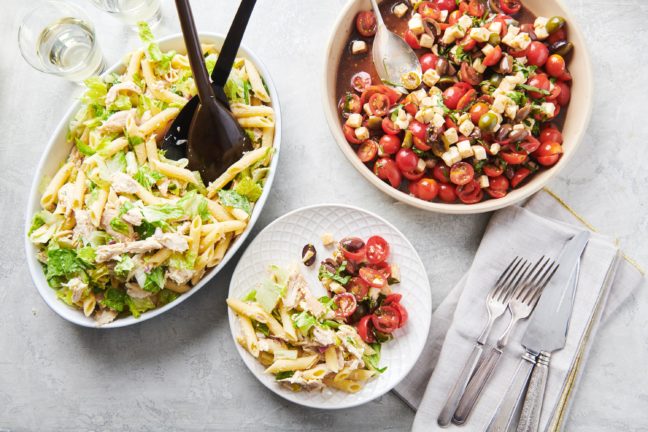 Tomato, Mozzarella and Basil Salad and pasta in bowls and on a plate.