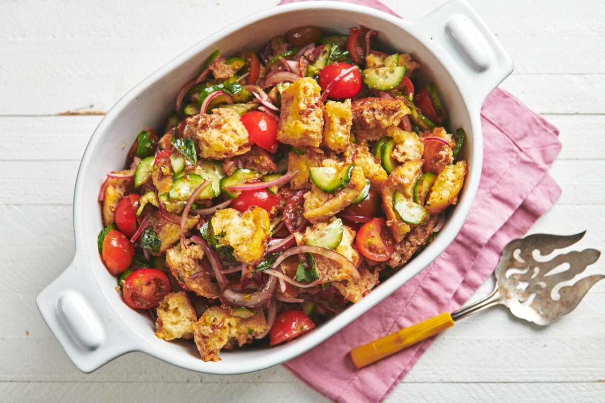 Tomato Panzanella in a white baking dish.