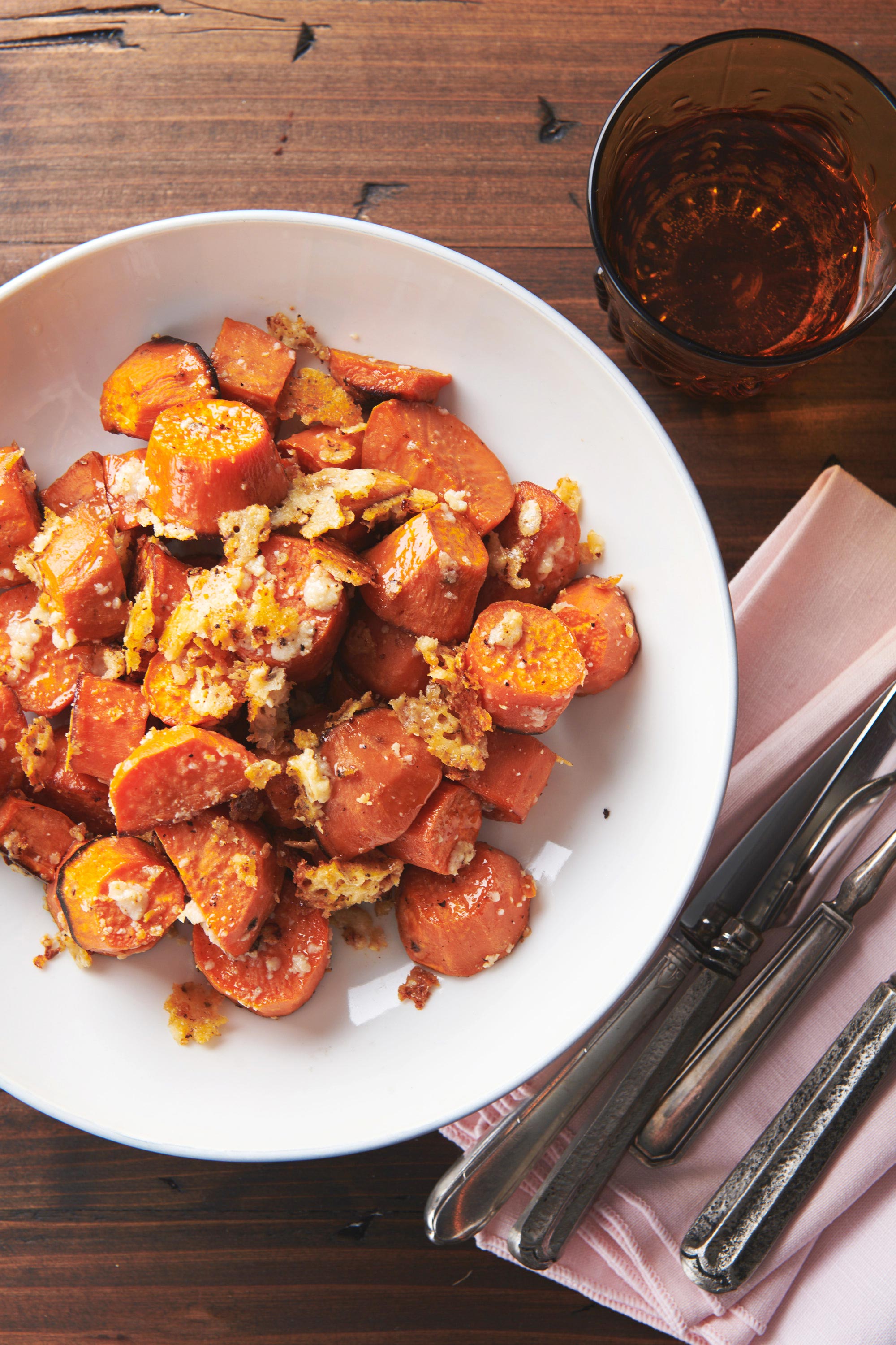 Garlic-Parmesan Sweet Potatoes in a white bowl.