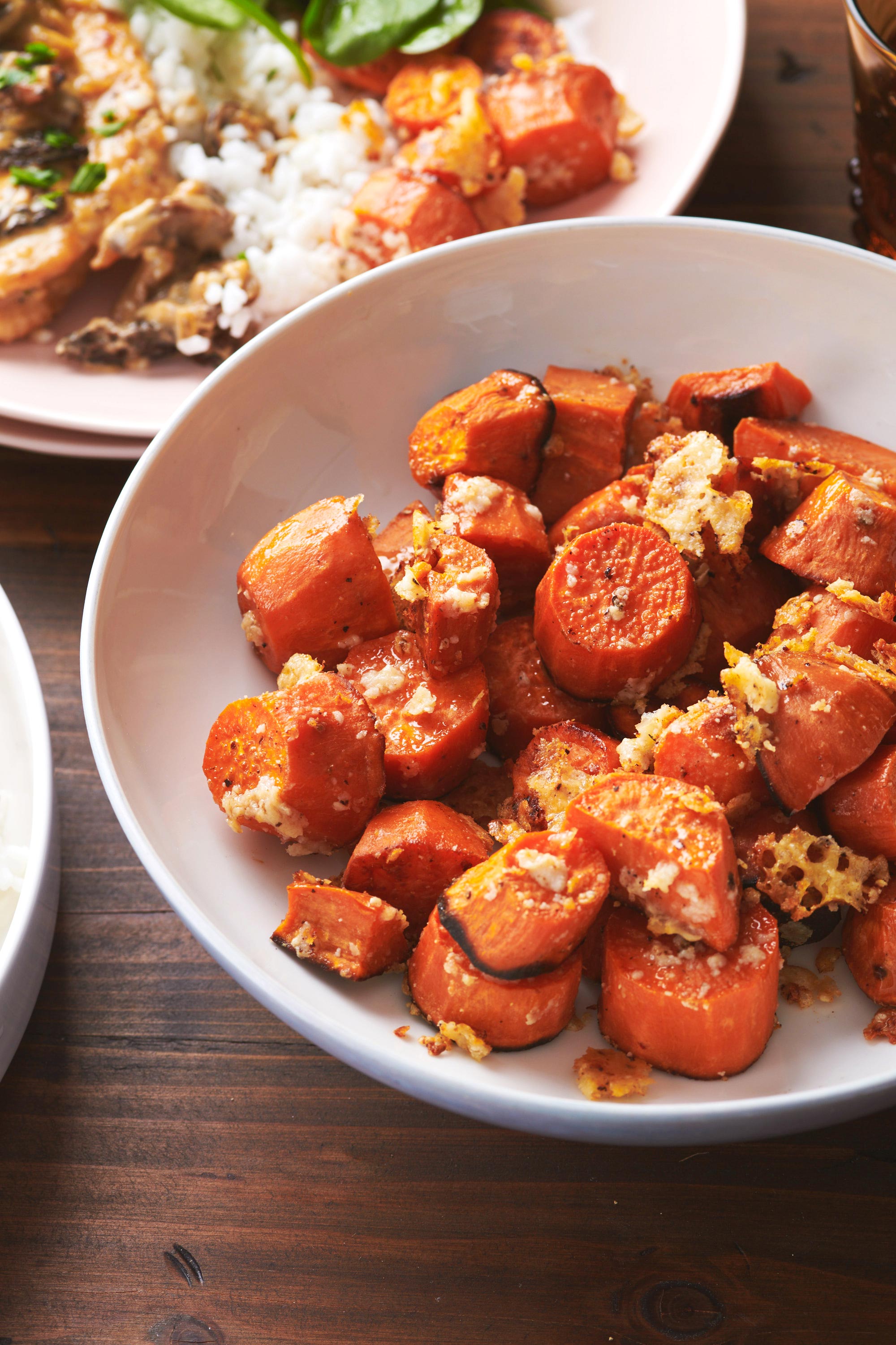 White bowl of Garlic-Parmesan Sweet Potatoes.