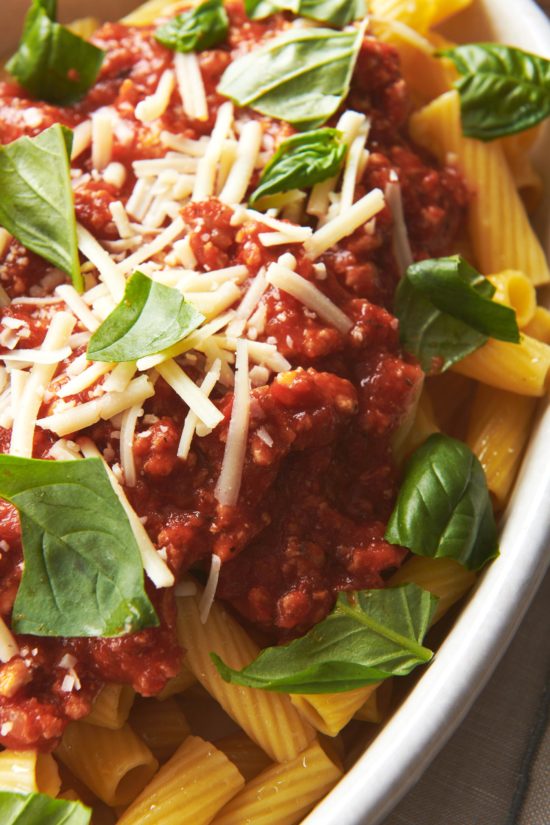 Pasta topped with Turkey Meat Sauce, cheese, and basil.