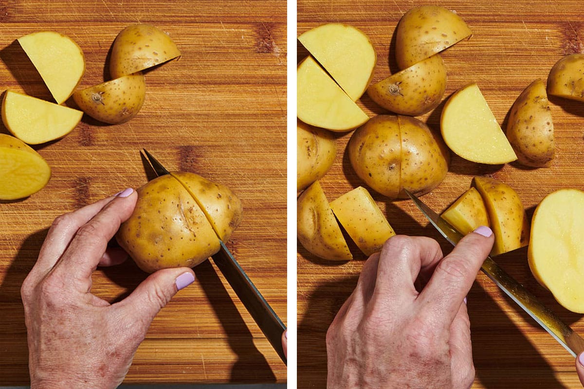 Cutting potatoes into cubes on wood cutting board.
