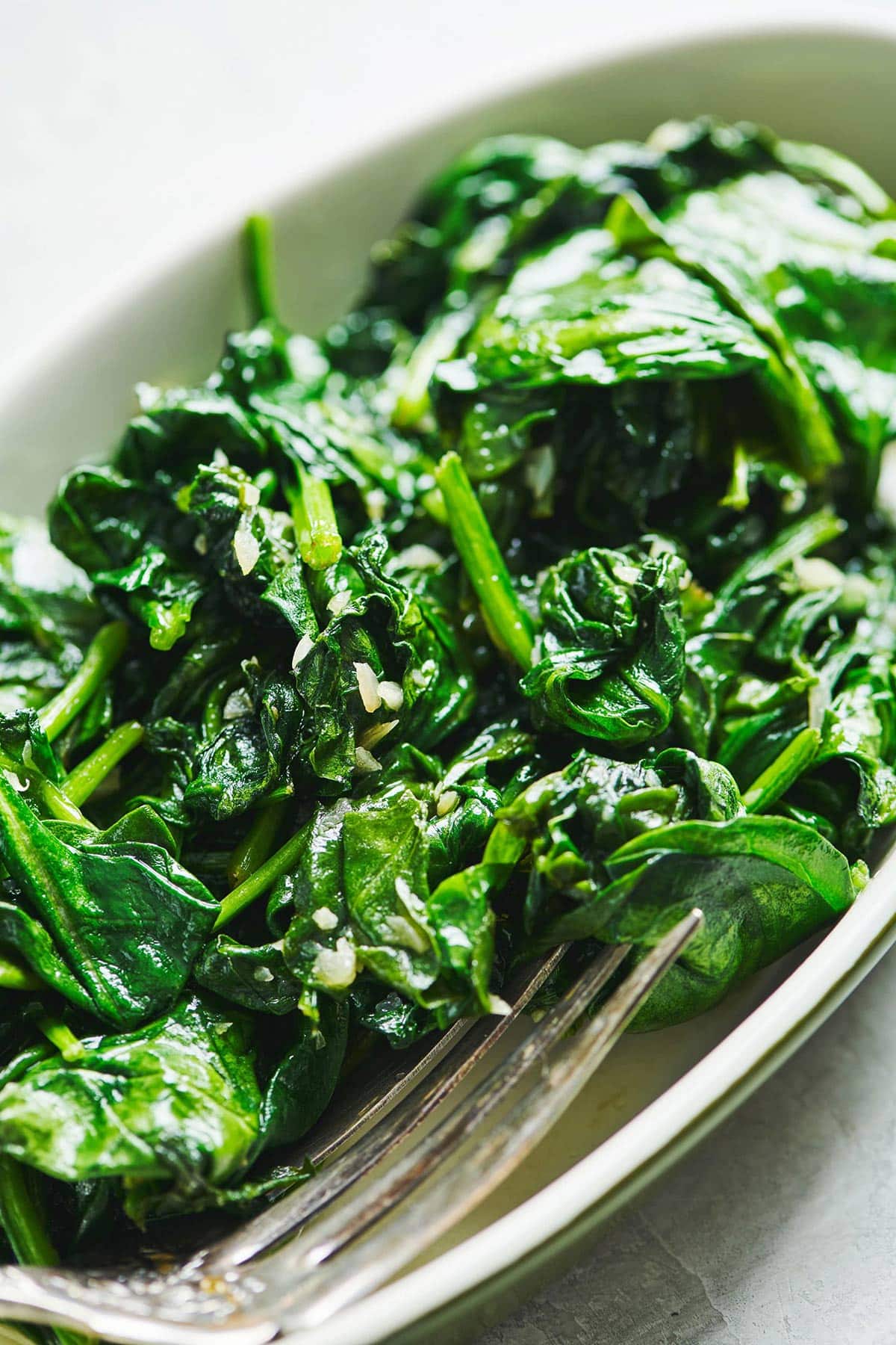 Sauteed spinach in a serving dish.