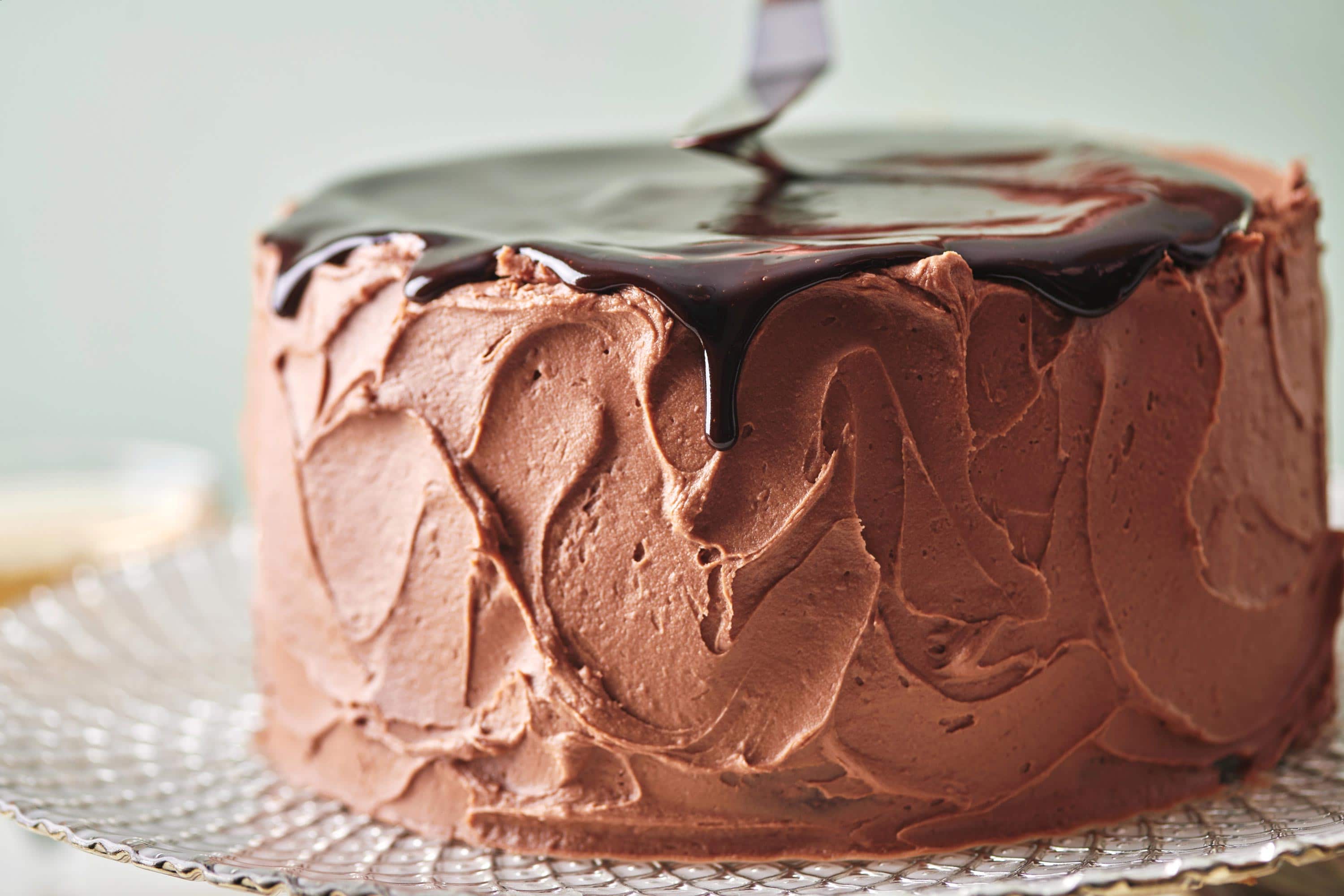 Chocolate dripping over the edge of a Devil\'s Food Cake.