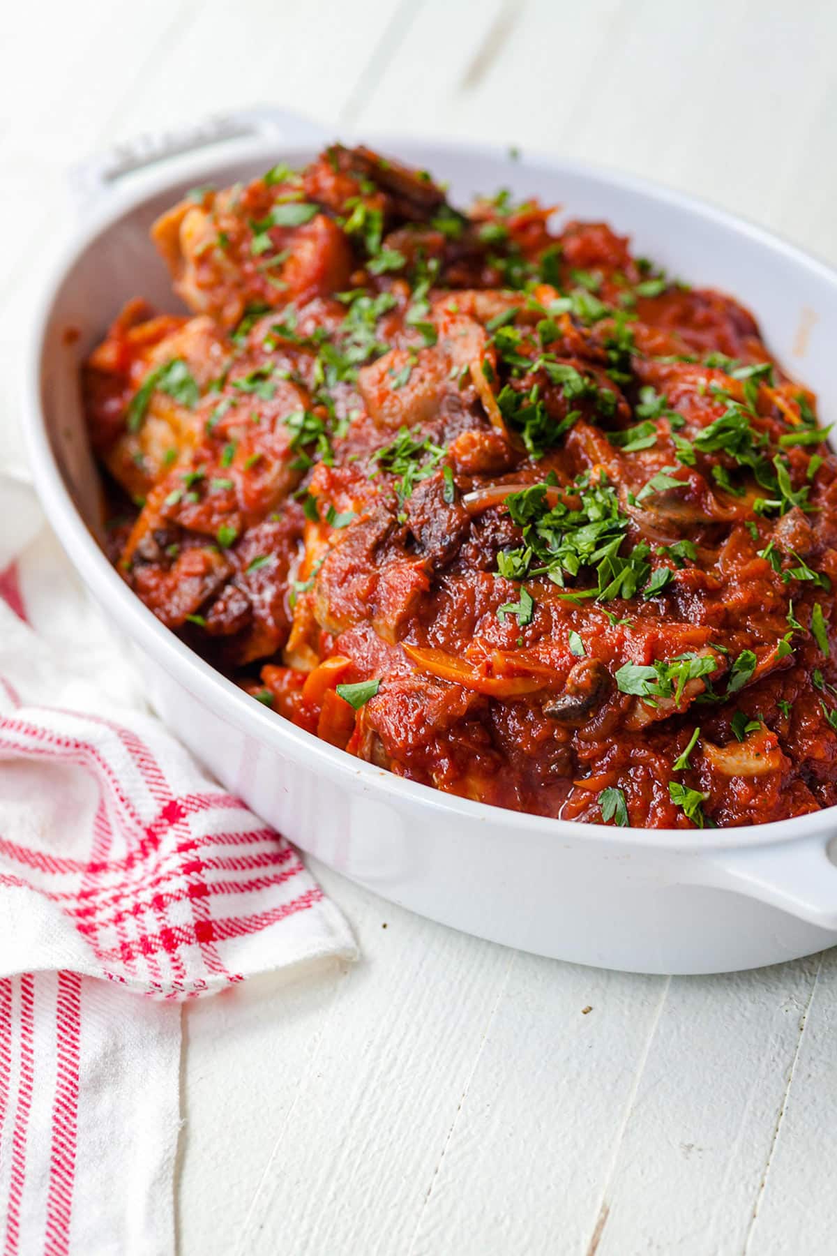 Chicken Cacciatore in a white dish.