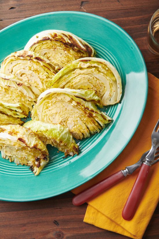 Roasted Cabbage Wedges on a blue plate.