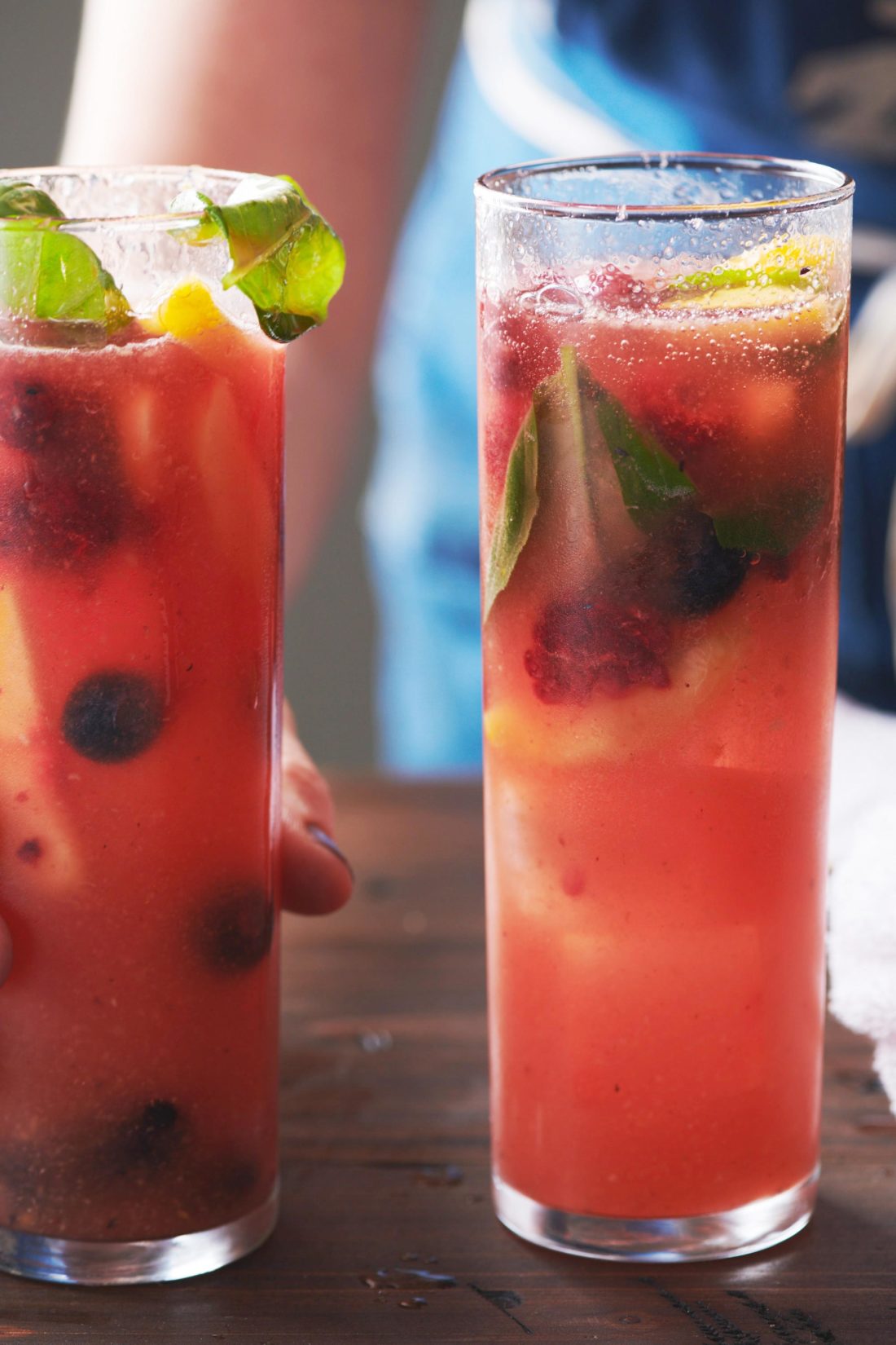 Two tall glasses of Fruit and Berry Sangria.