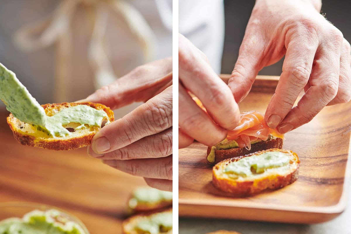 Making Smoked Salmon Crostini with Herbed Mayonnaise on cutting board.