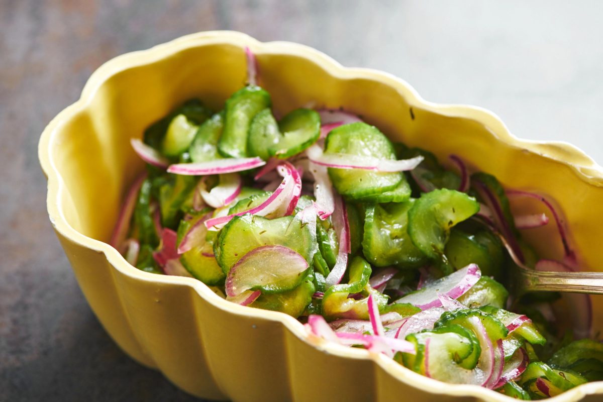 Cucumber Salad in a yellow bowl.
