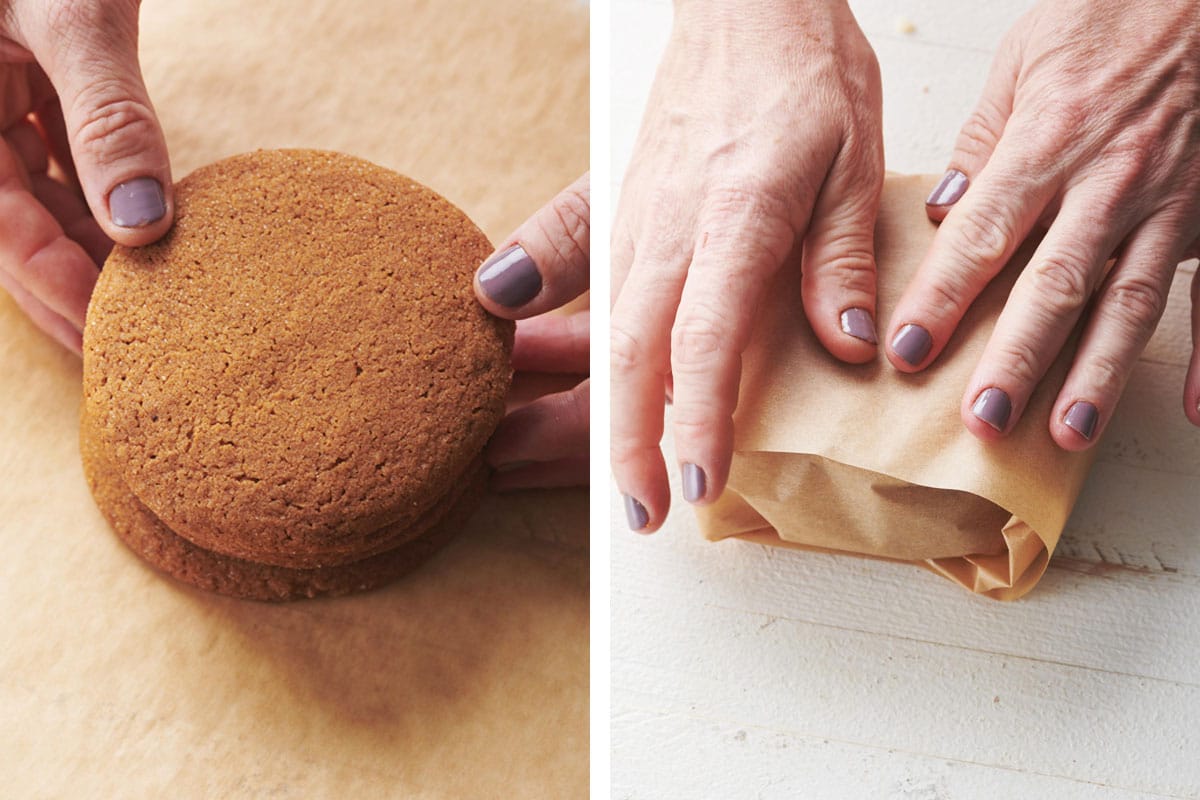 Woman wrapping gingersnap cookies in parchment paper.