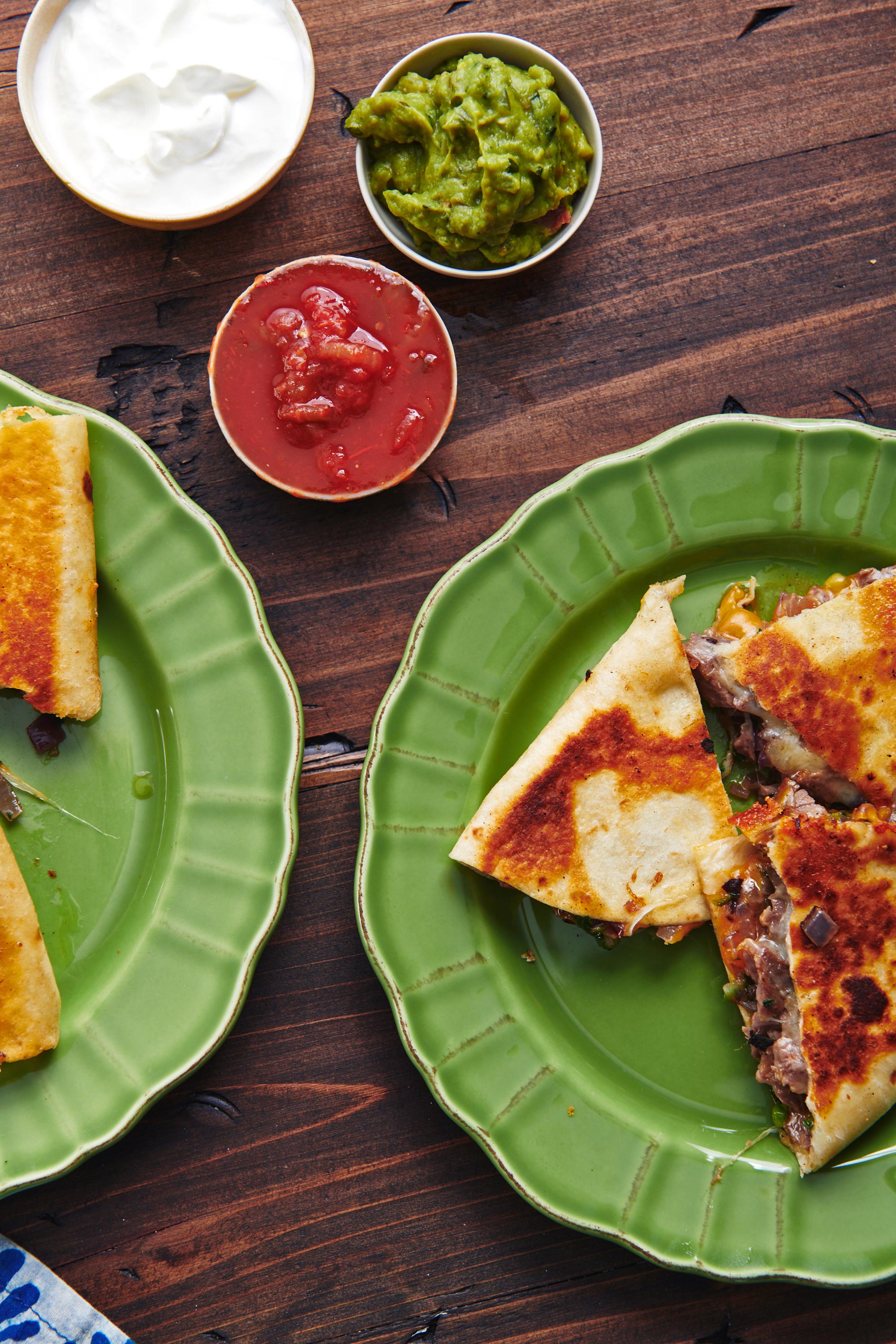 Steak and Cheese Quesadillas on green plates.