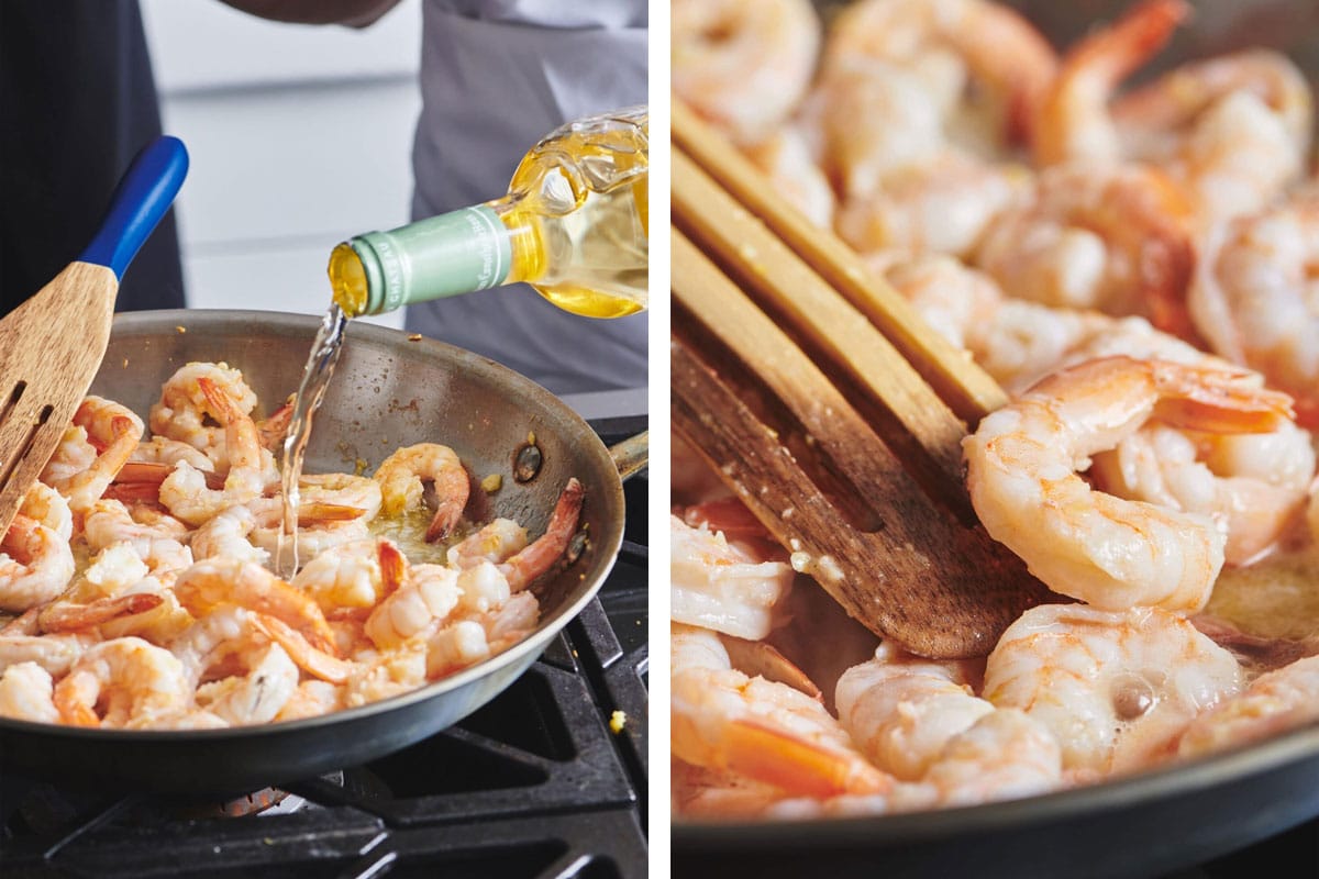 Sauteing shrimp in white wine sauce on stove.