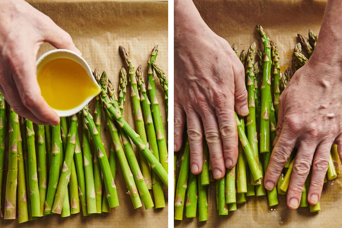Tossing fresh asparagus with oil on parchment-lined pan.