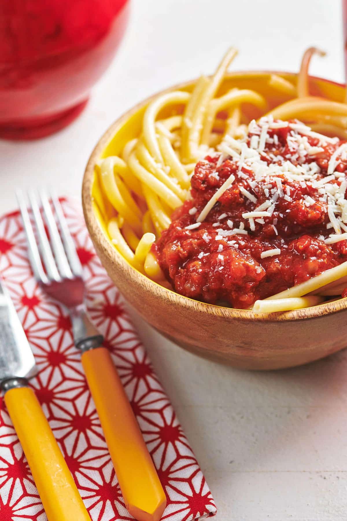 Both of noodles with Meat Sauce and parmesan cheese.