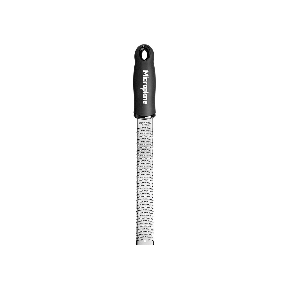 Microplane grater with a black handle.