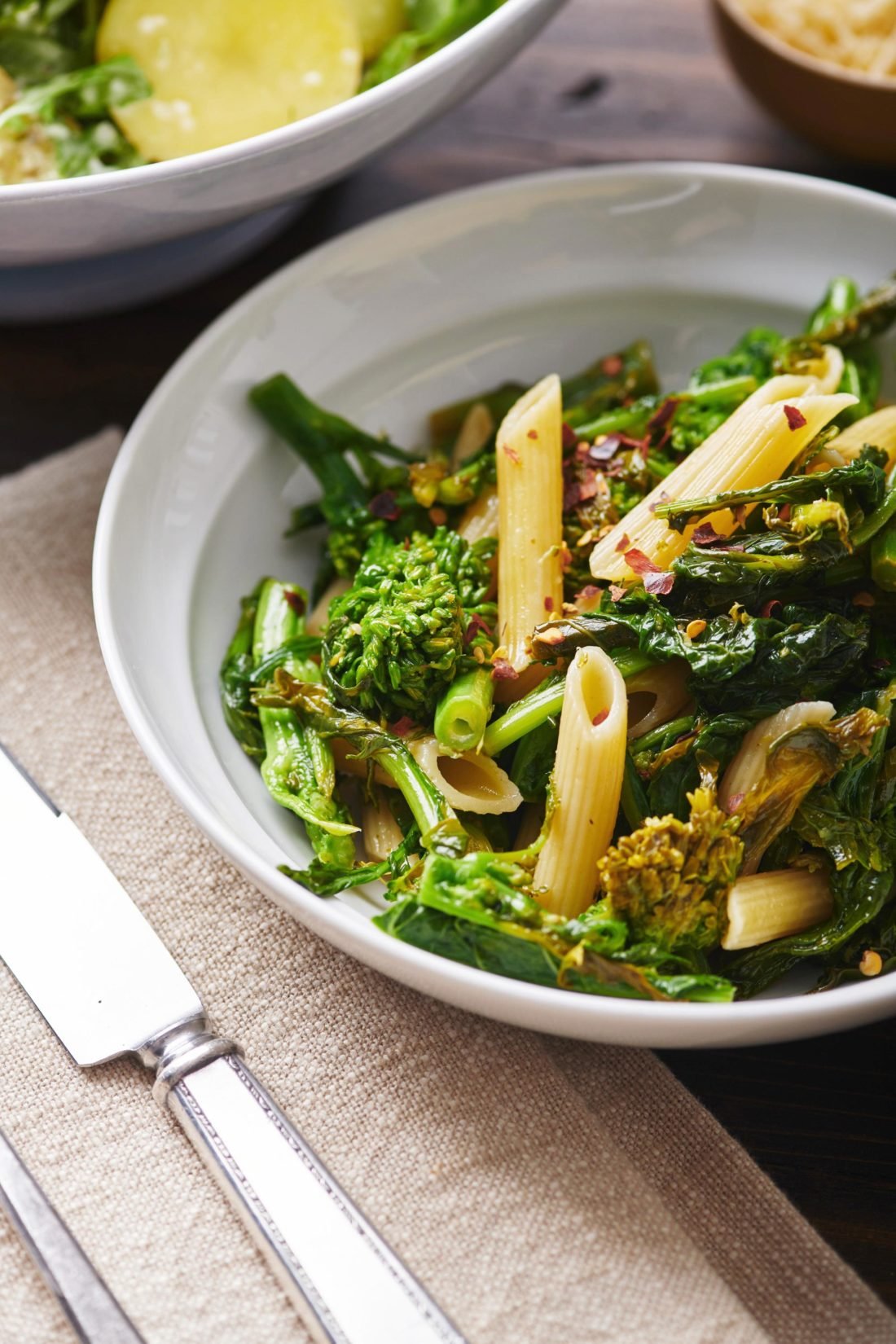 White bowl of Pasta with Broccoli Rabe.