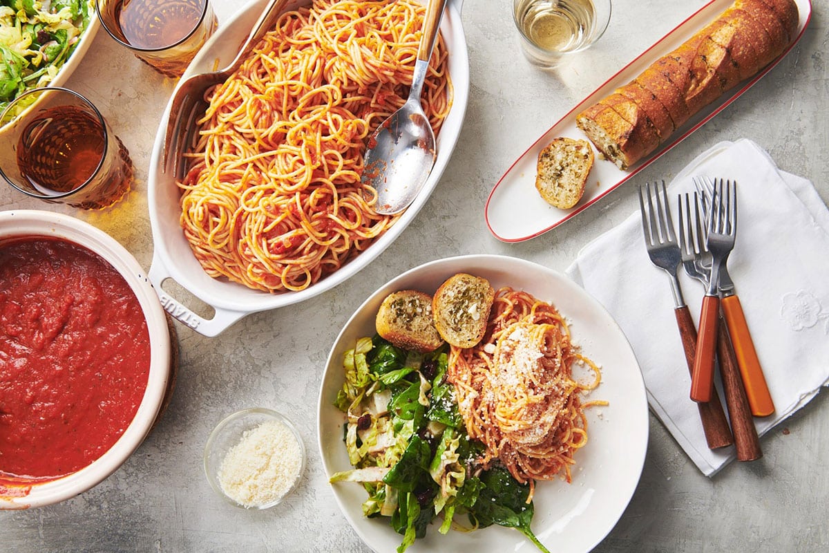 Ranch Garlic Bread on a plate with pasta and salad.