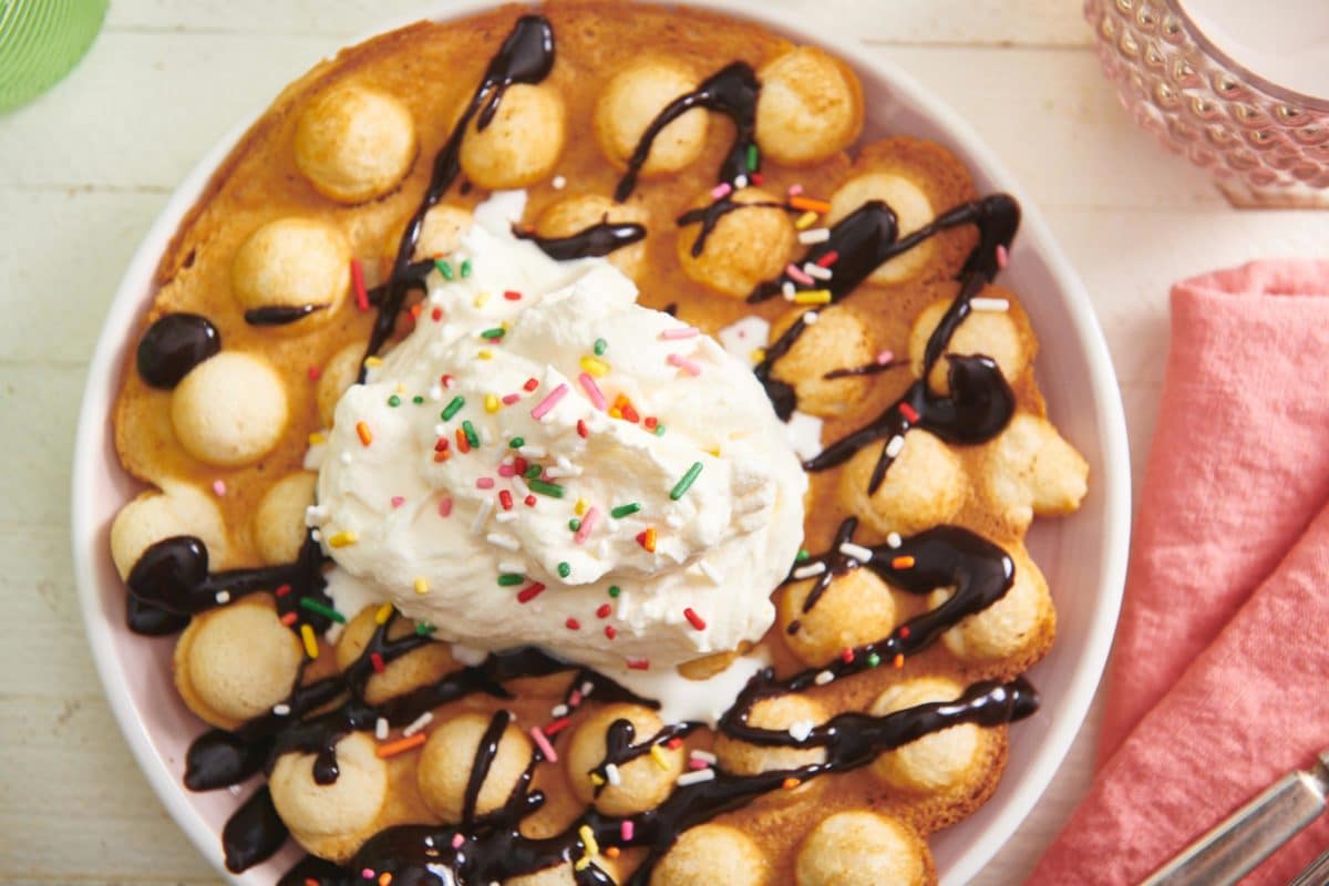 Bubble Waffle topped with chocolate and ice cream.