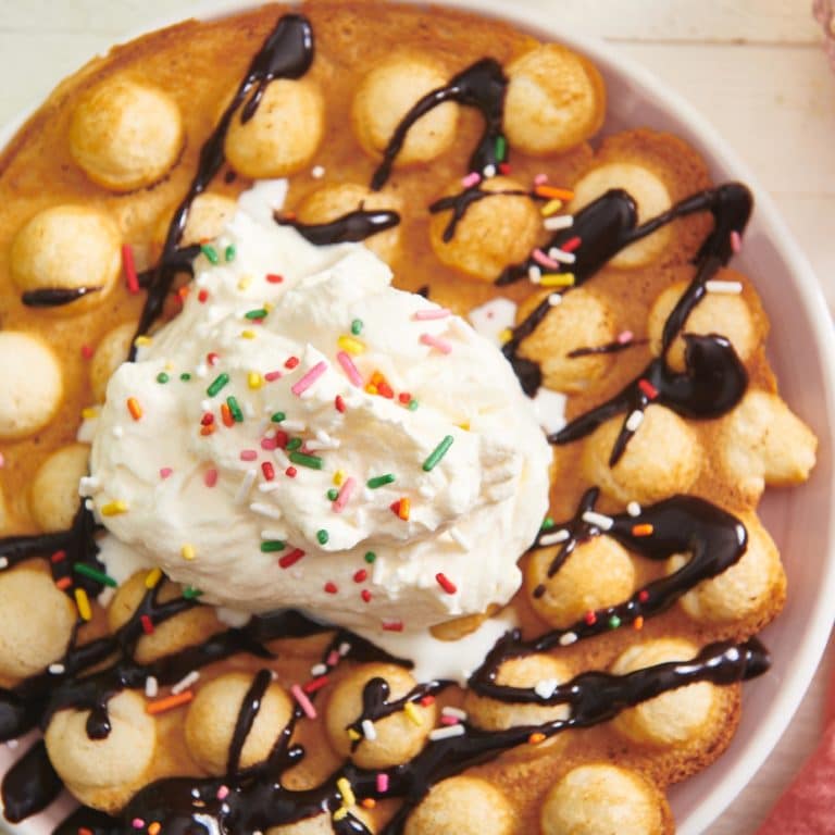 Bubble Waffle topped with chocolate and ice cream.