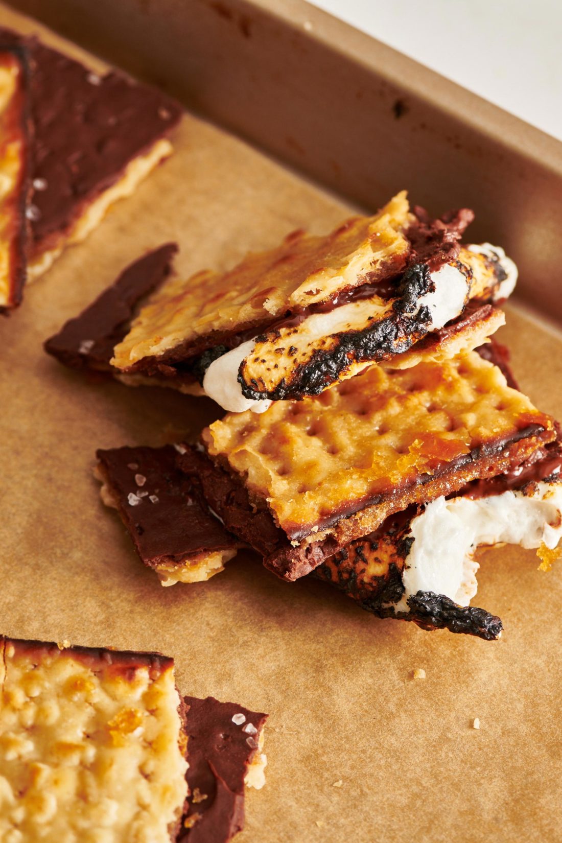 Chocolate Covered Caramelized Matzoh S’Mores on parchment paper.