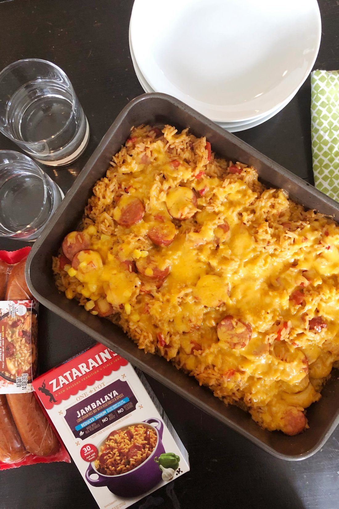 Cheesy Jambalaya and Cajun Sausage in a baking dish.