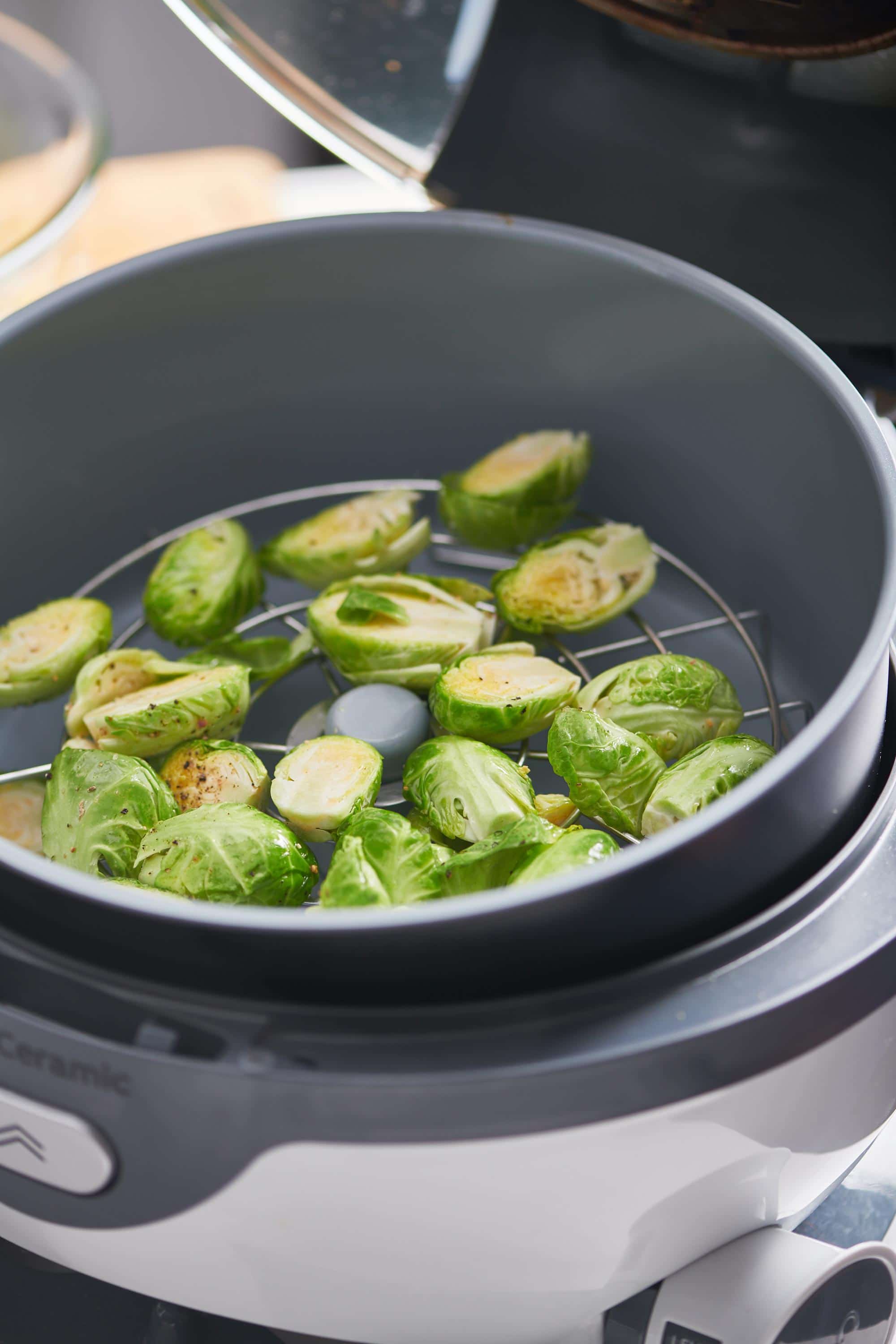 Fresh Brussels sprouts in an air fryer.