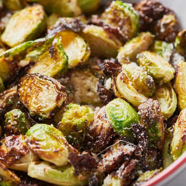 Brussels sprouts topped with Parmesan cheese.