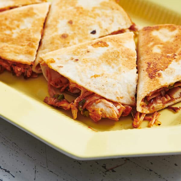 BBQ chicken quesadillas on yellow plate.