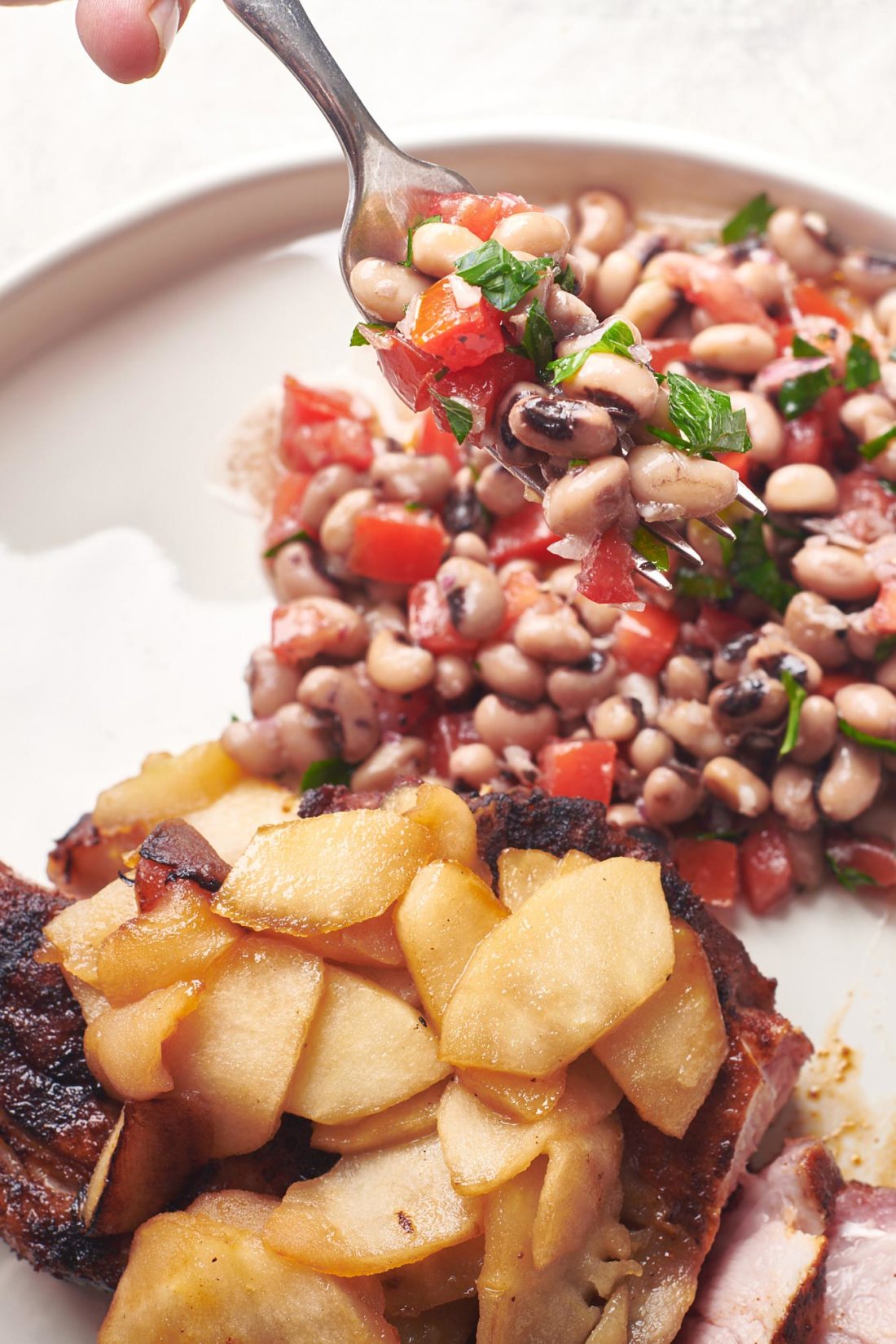 Black-Eyed Pea Salad on a plate with meat.
