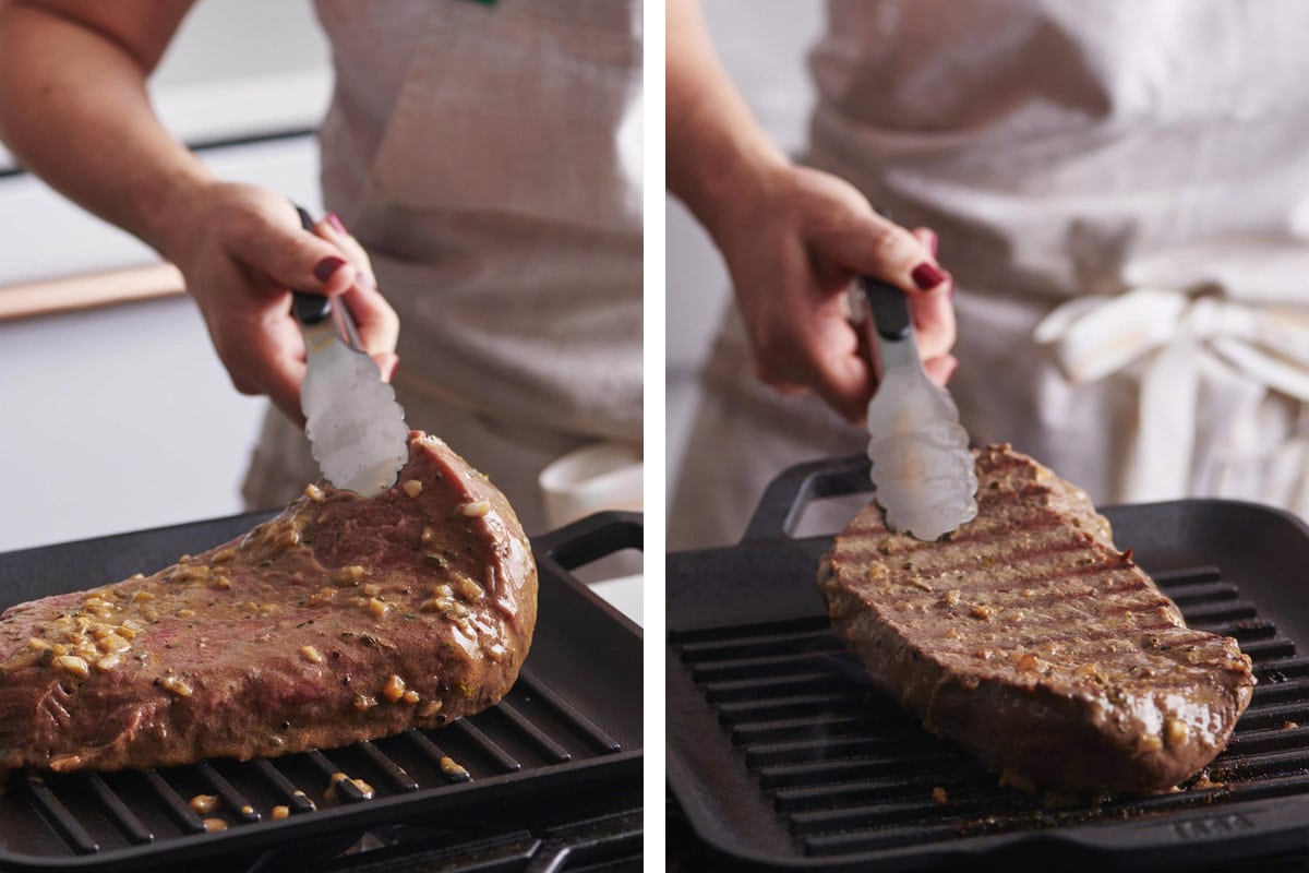Woman cooking London broil on indoor grill plate.