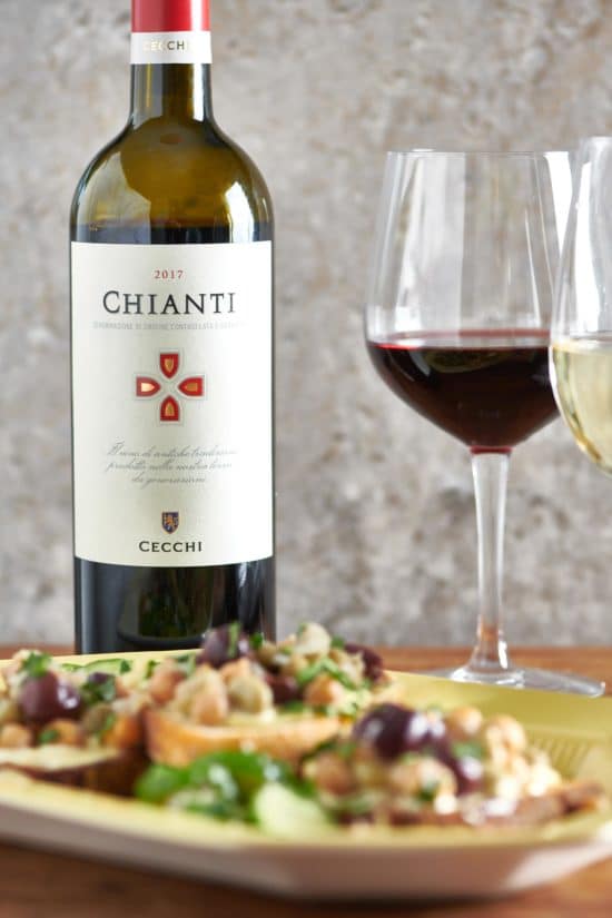 Bottle of Cecchi Chianti on a table with seafood stew.
