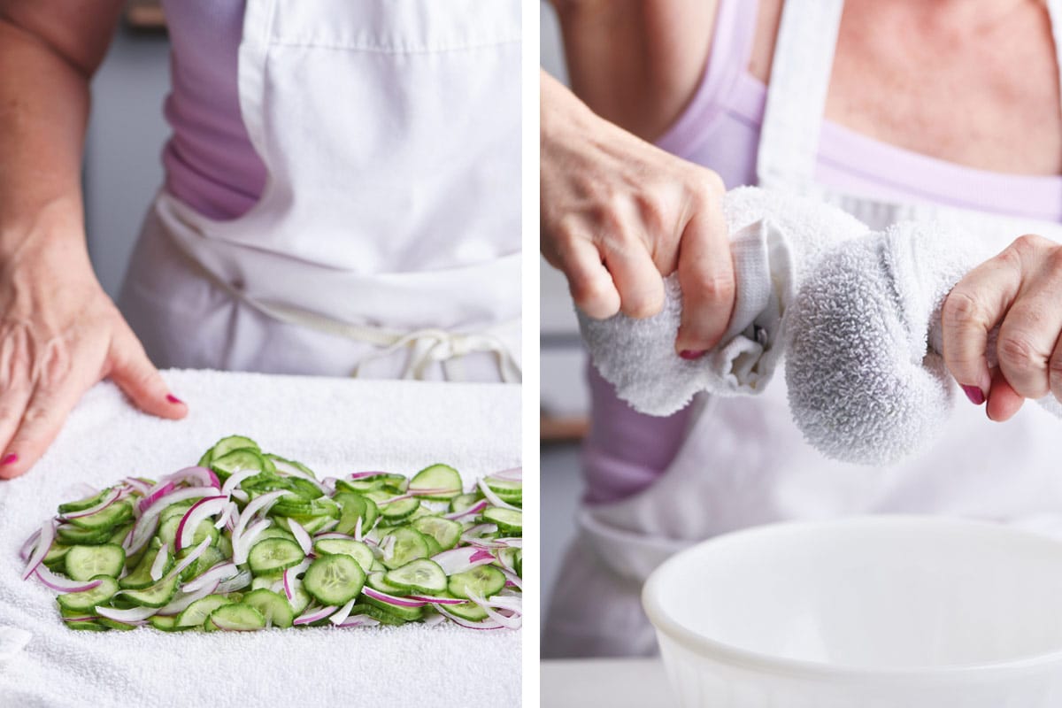 Draining salted cucumber and red onion slices with dishtowel.